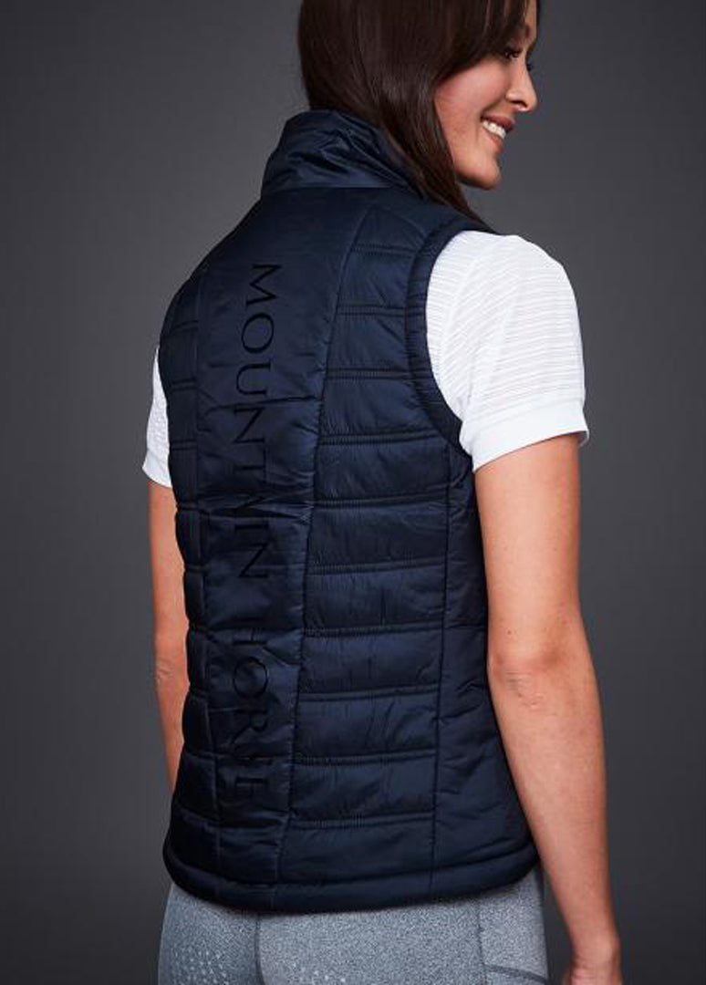 Model wears mountain horse star vest, back view showing full length logo